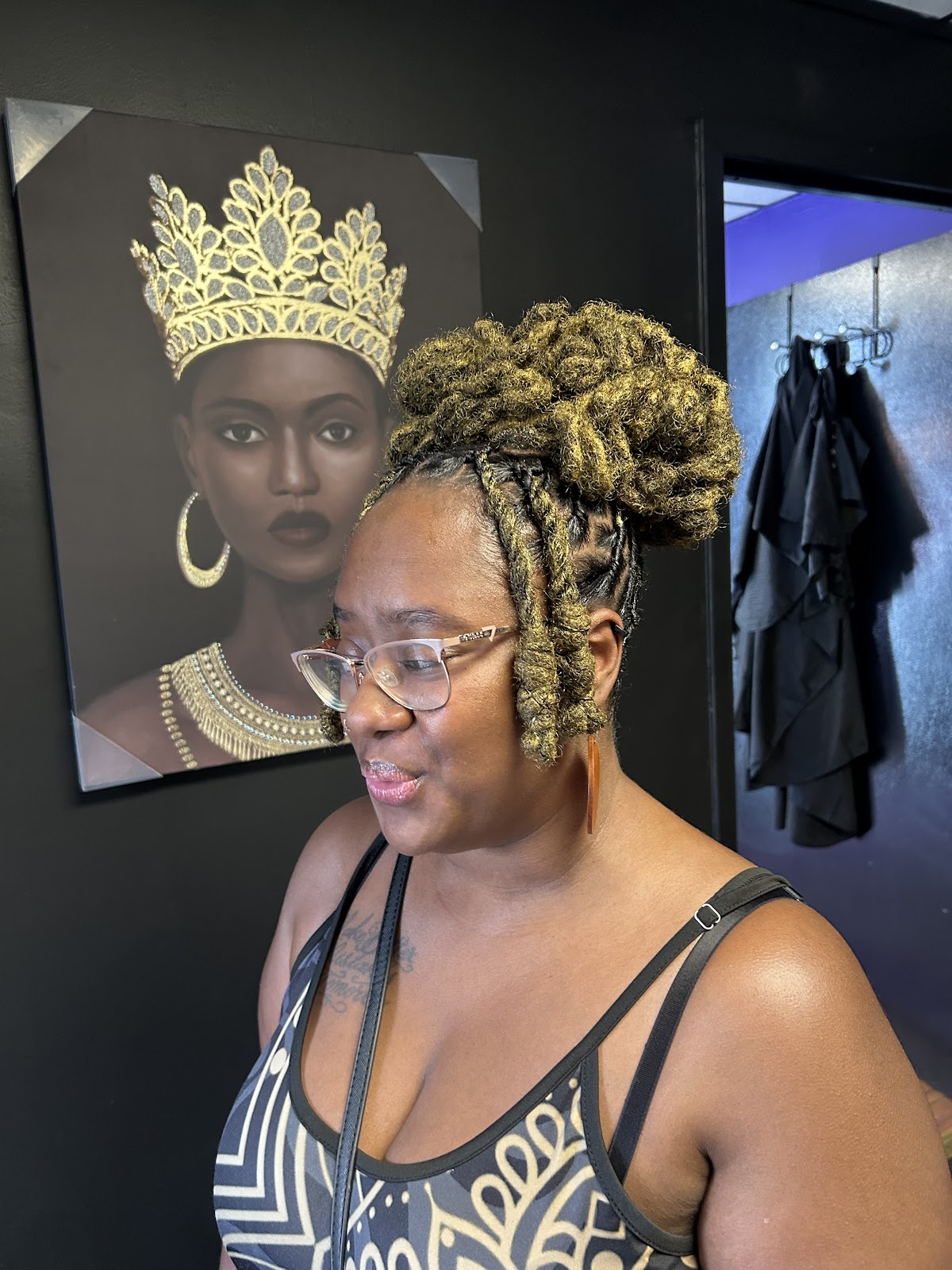 Honey-gold loc updo styled inside the salon